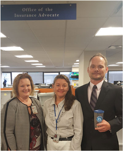 Claire Jubb and Del Schwalls with Rhonda Montgomery, Deputy Director in the Office of the Flood Insurance Advocate